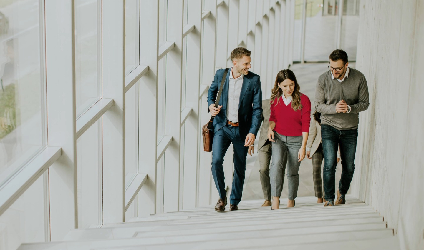 Colleagues discuss the company's success together